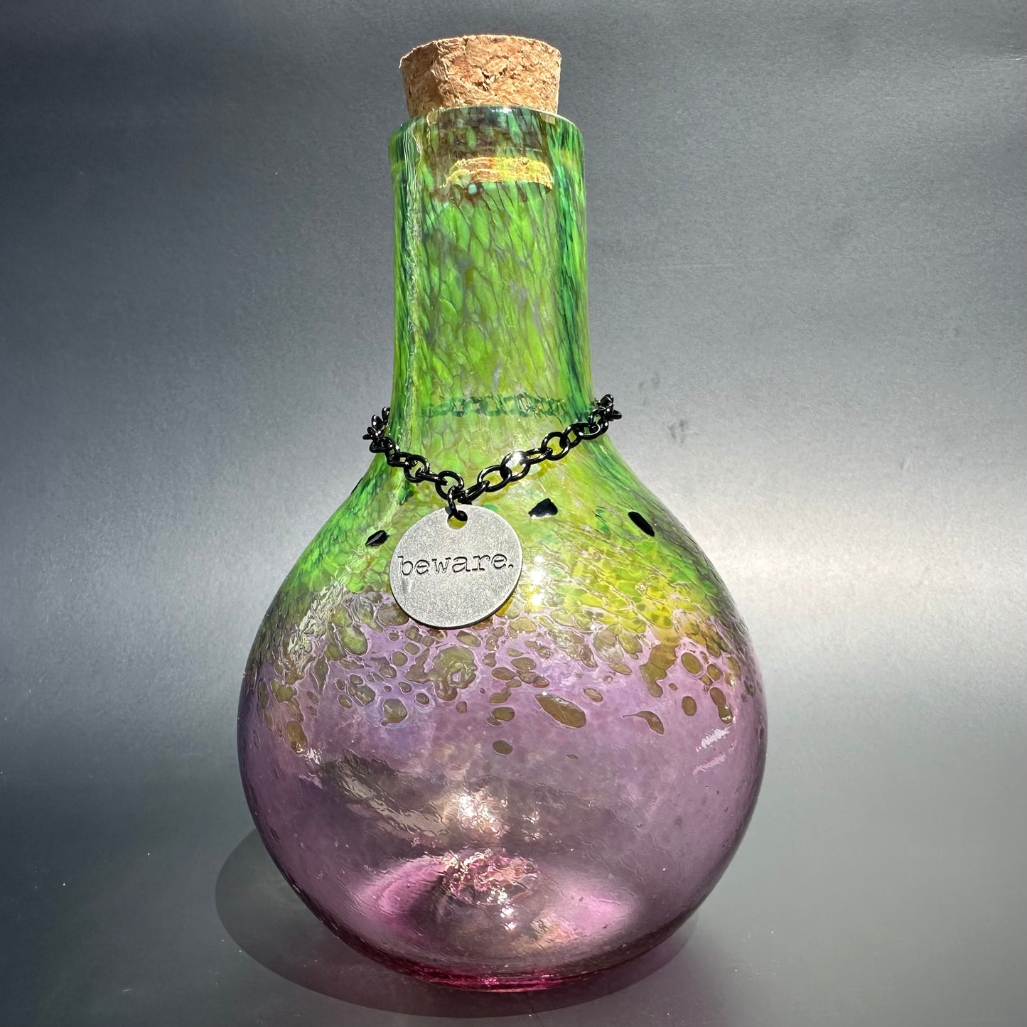 alt="Green/Purple Beware Potion Bottle"