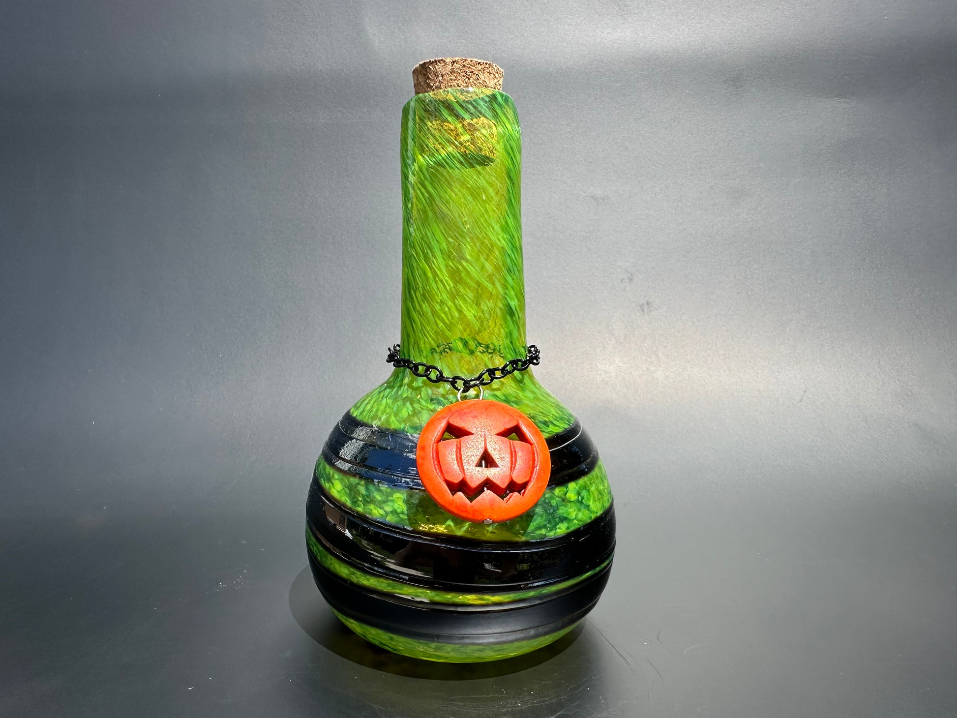 alt="Green&Black w/pumpkin charm Potions Bottle"